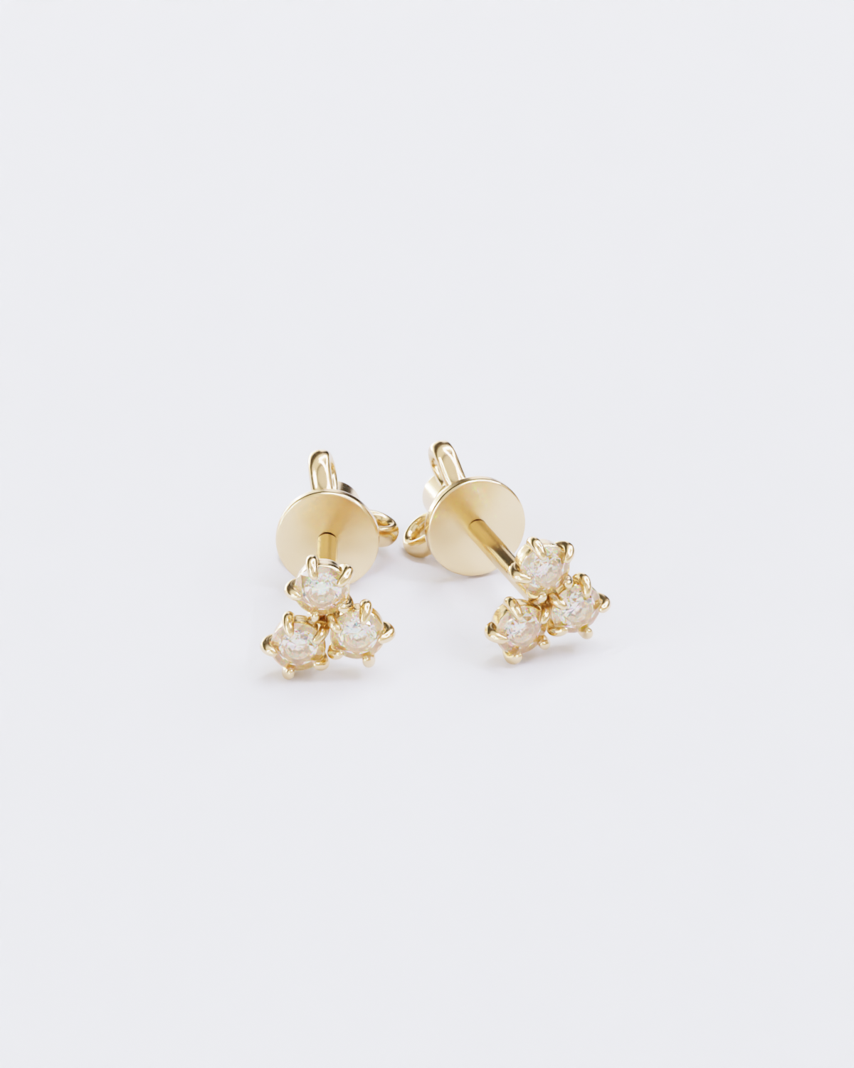 Gold piercing studs with diamonds